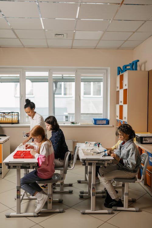 Free Young Students Experimenting Inside the Classroom Stock Photo