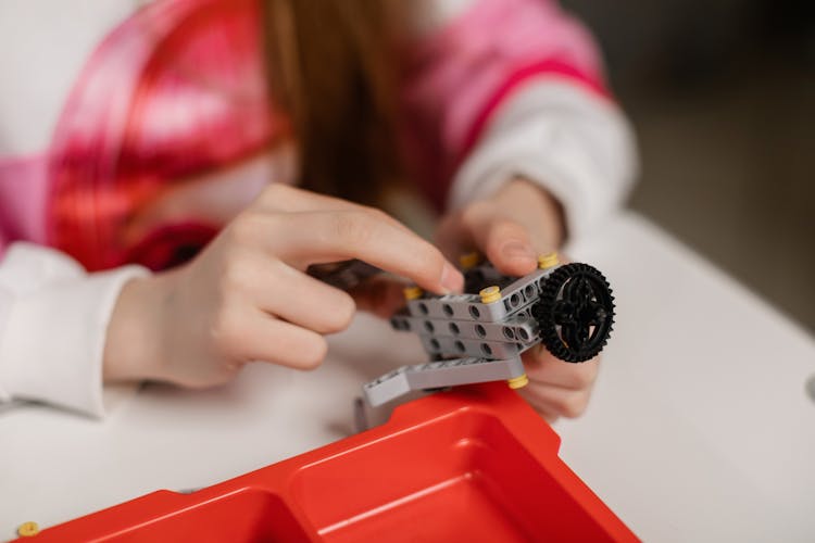 Person Playing Lego