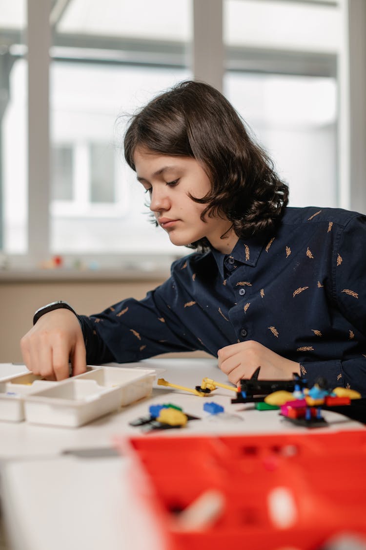 Long Hair Boy Playing Lego Blocks