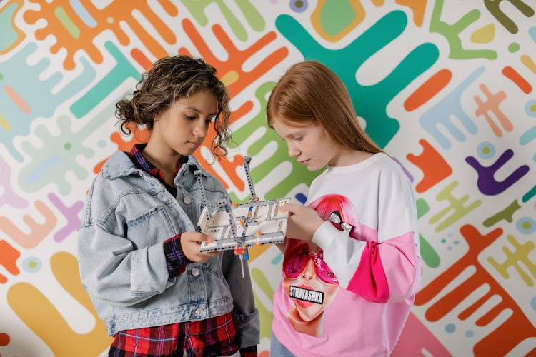 Girls Holding A Toy