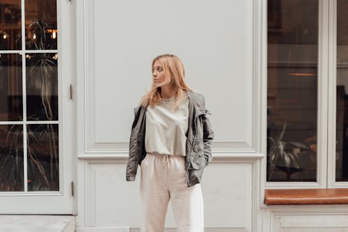 Beautiful Model in a Gray Jacket Posing with Her Hands in Her Pockets