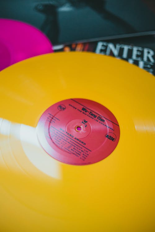 Free Close-up Photo of a Yellow Vinyl Record Stock Photo