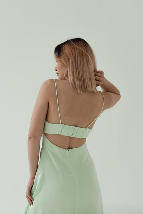 A Woman Wearing a Backless Dress