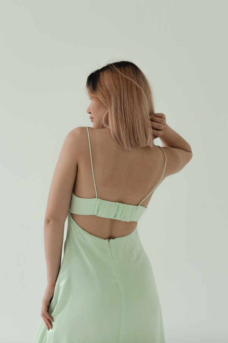 A Woman Wearing A Backless Dress