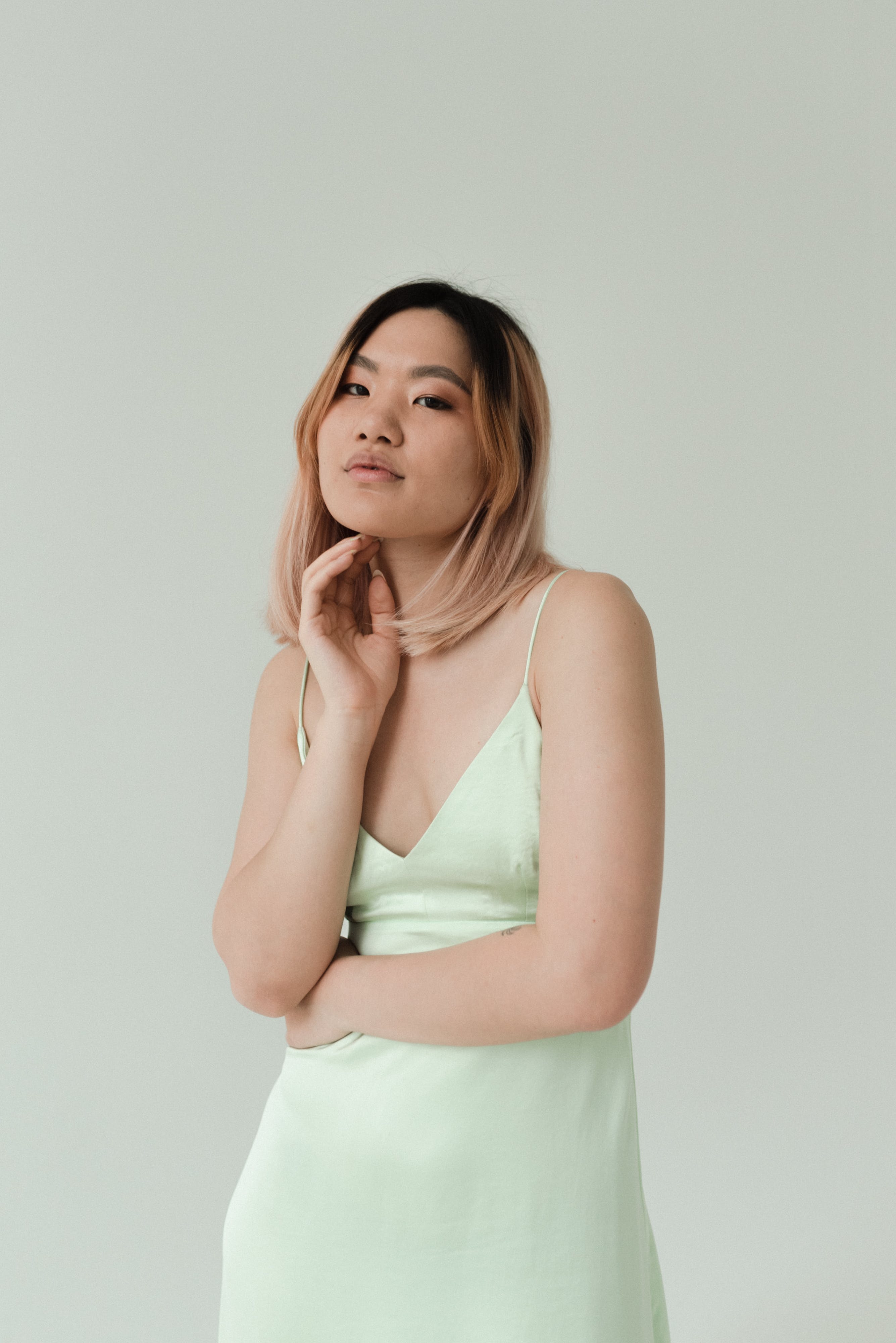 A Pretty Woman Wearing a Green Dress  Free Stock Photo