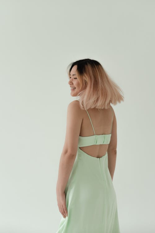 Woman in Mint Green Spaghetti Strap Dress