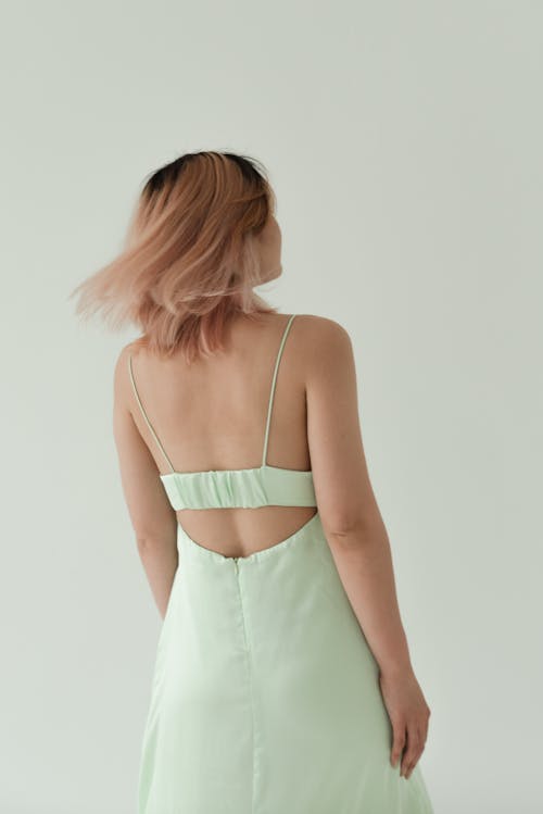 Back View of a Woman in a Light Green Dress