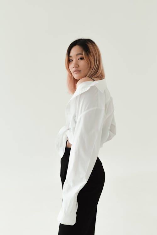 A Beautiful Woman Wearing a Dress Shirt and Black Pants