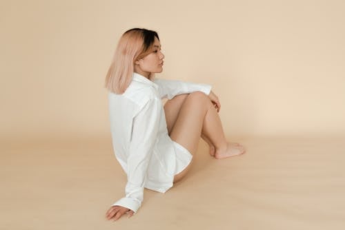 Woman in White Button Down Shirt Sitting 