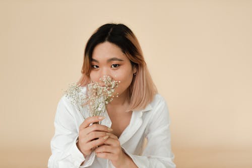 Beautiful Woman Holding Flowers