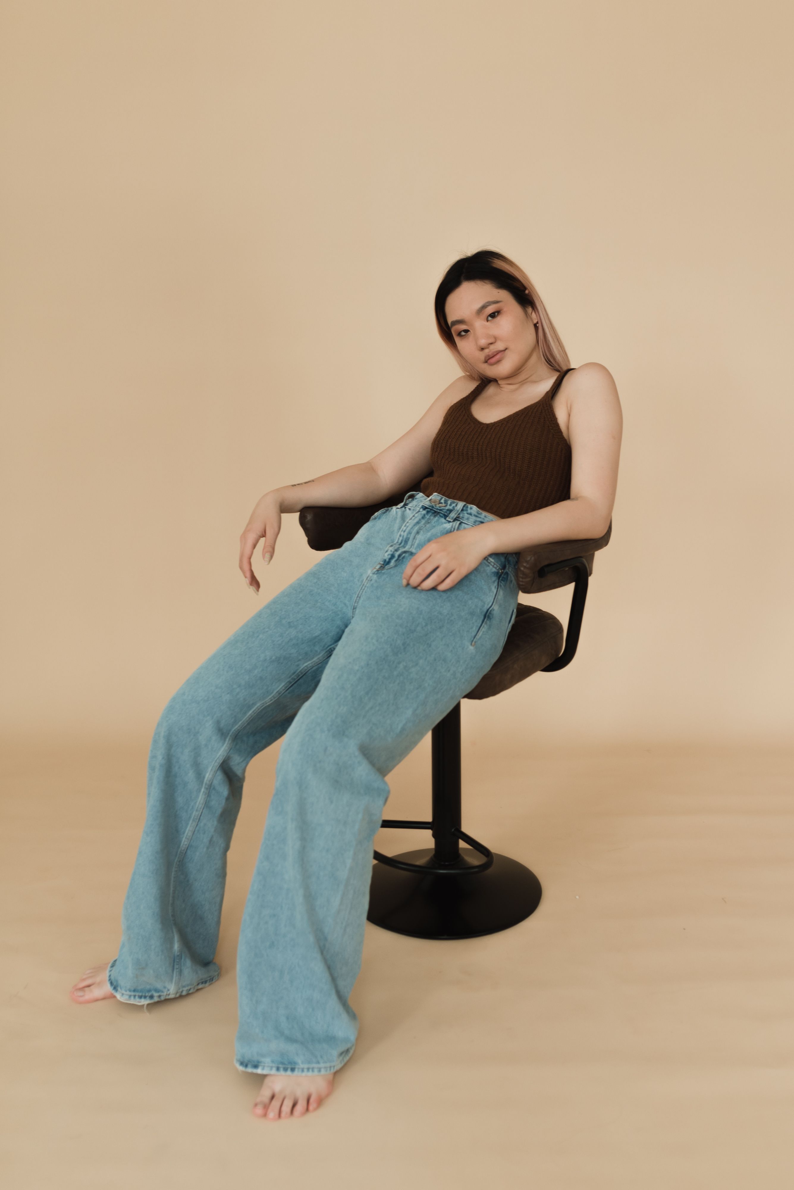 Woman in Brown Tank Top and Blue Denim Jeans · Free Stock Photo