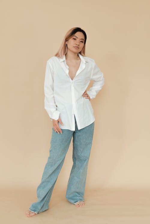 Woman in White Button Down Shirt and Denim Jeans