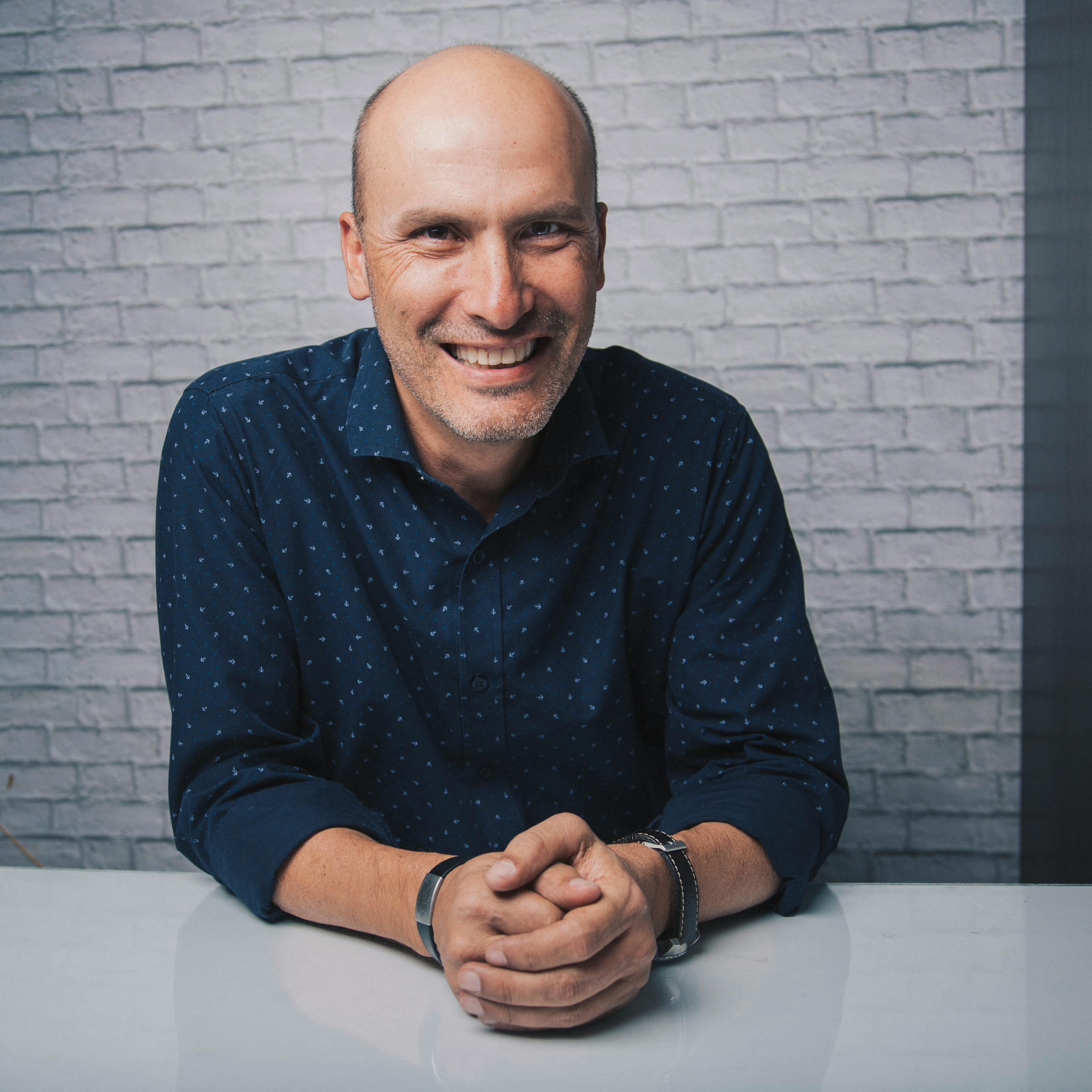 cheerful mature man in shirt smiling