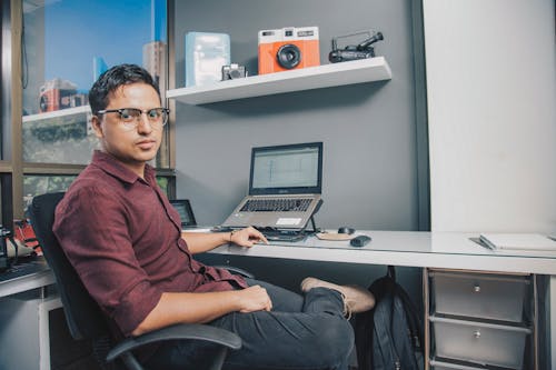 Free A Man Sitting on an Office Chair Stock Photo