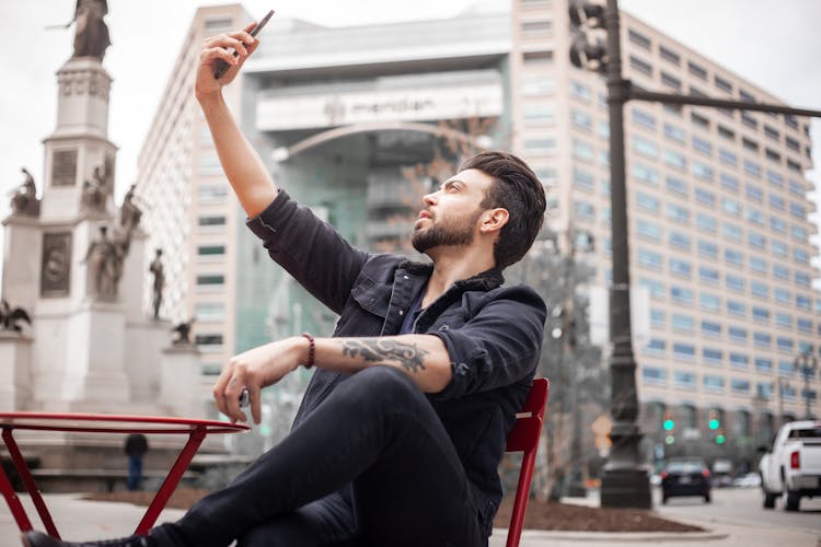 A Handsome Man Taking A Selfie