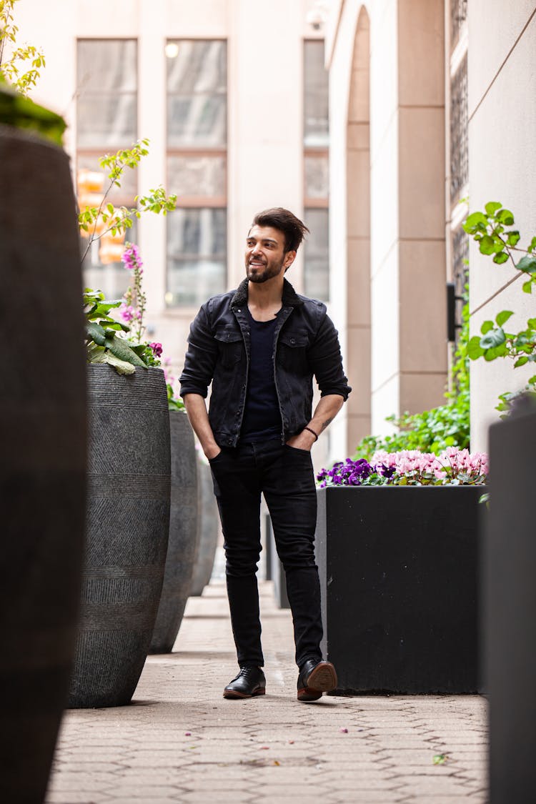 Man In Black Casual Wear Walking With Hands In Pockets