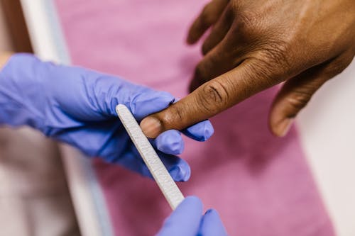 Close-Up Shot of a Person Getting a Nail File