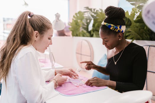 Two women selecting nail polish colors at a chic nail salon.