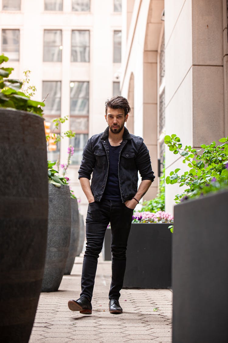 Man In Casual Wear Walking On Pavement