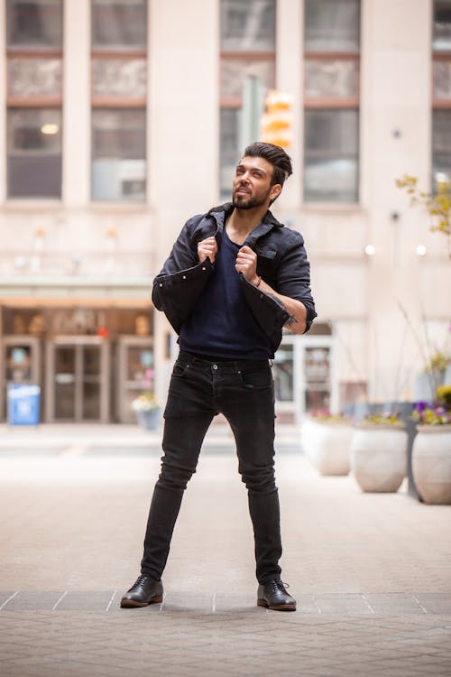 Man in Black Jacket and Pants Standing on Street