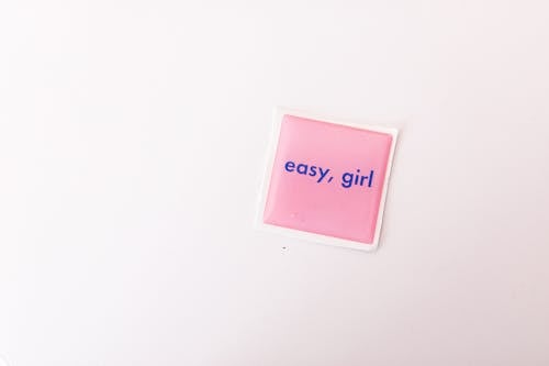 Free Pink Sticky Note on White Wall Stock Photo