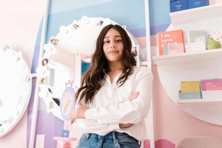 Woman Wearing White Button Up Long Sleeve Shirt And Denim Pants