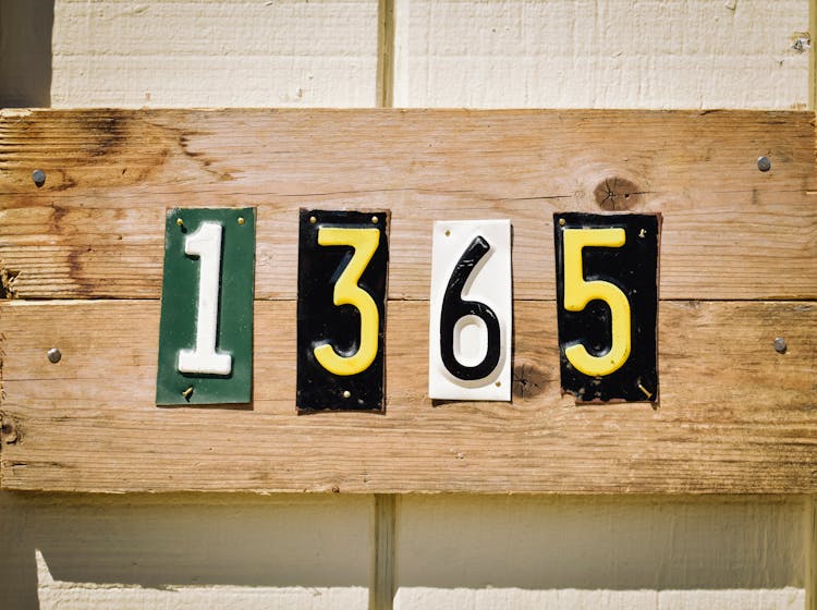 A Set Of Numbers Posted On Wooden Planks