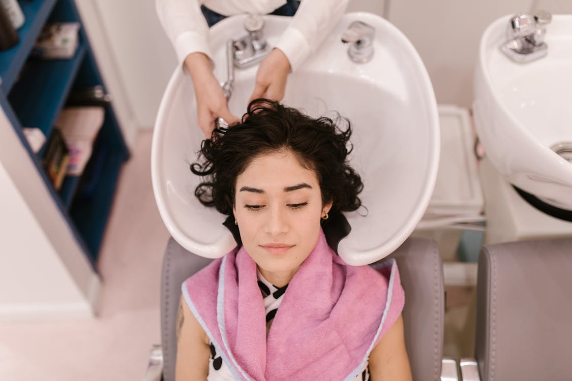 A Woman Lying Near the Sink