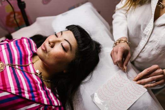 A woman enjoys a relaxing eyebrow grooming session at a luxury spa, eyes closed in comfort.