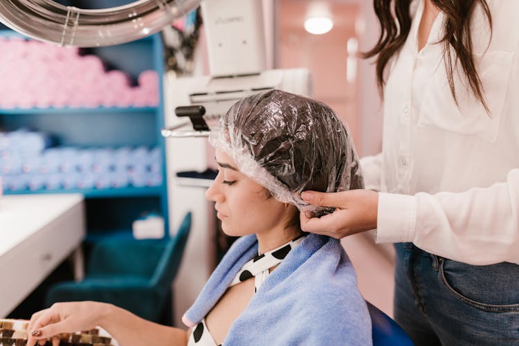 A Woman Wearing A Shower Cap