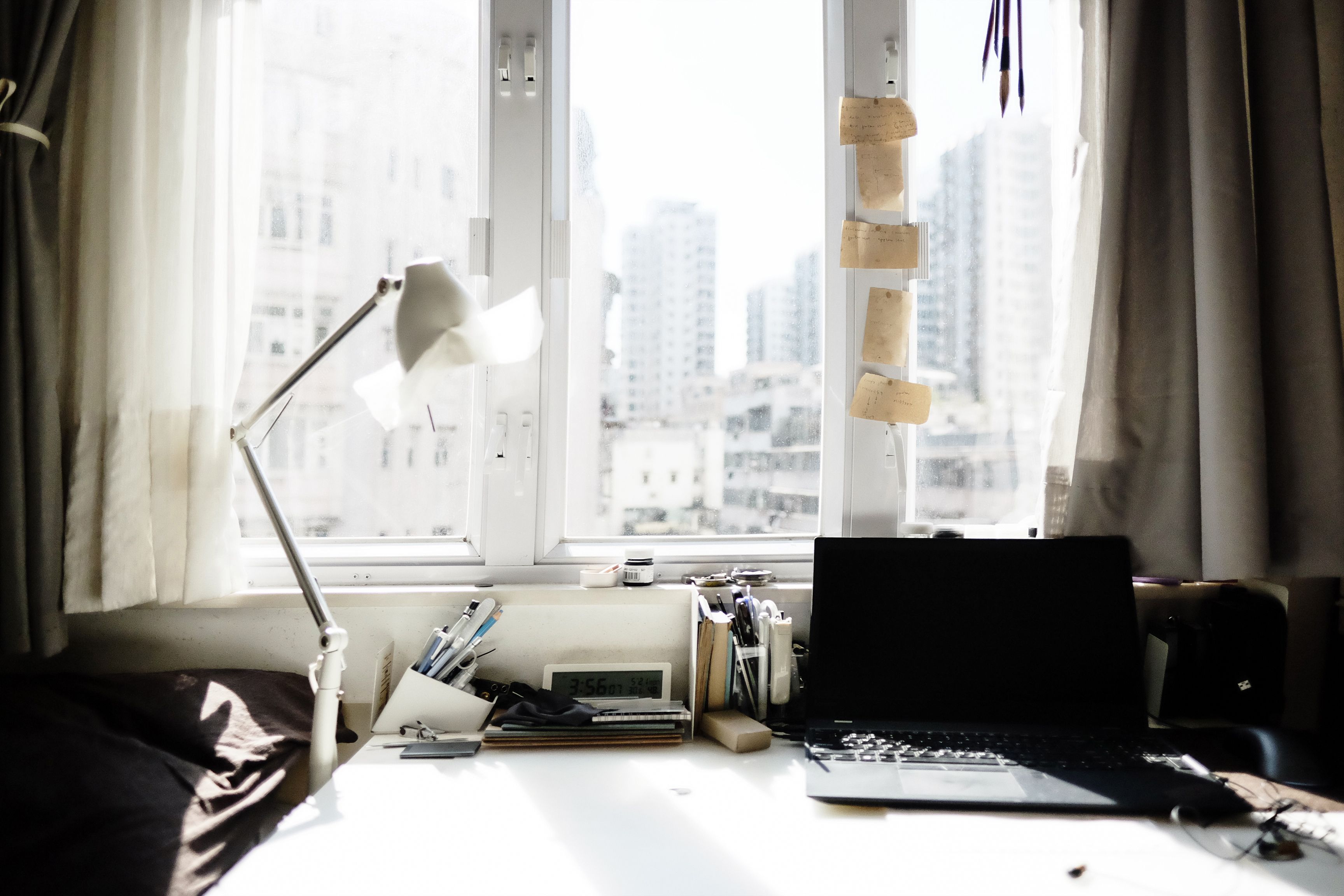 Laptop on Wooden Desk beside Window Pane · Free Stock Photo