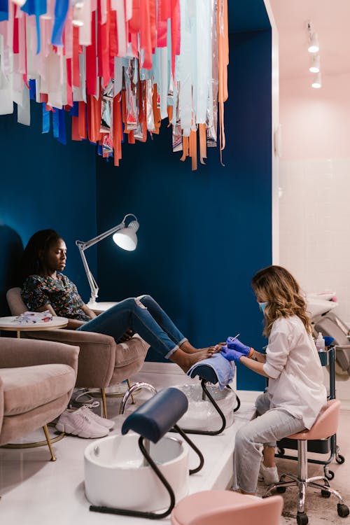 Free Woman Getting Her Toenails Done Stock Photo