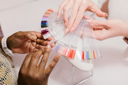 Free A Client Choosing on a Nail Color Palette Stock Photo