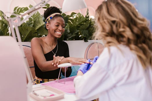 African American woman happily receiving a manicure in a stylish, modern nail salon.