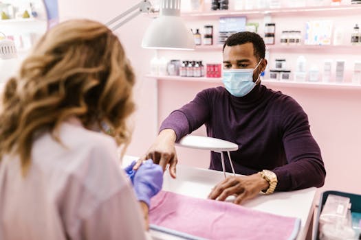 A man receives a manicure in a stylish nail salon, showcasing self-care and grooming.