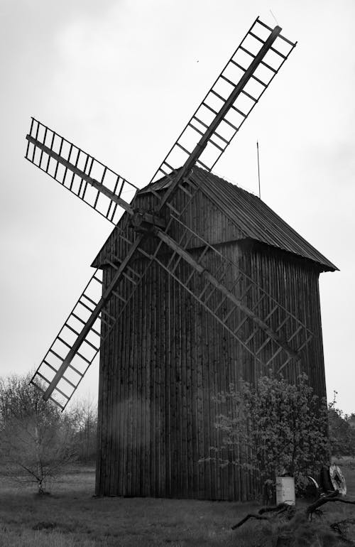 Grayscale Photography of a Wooden Windmill