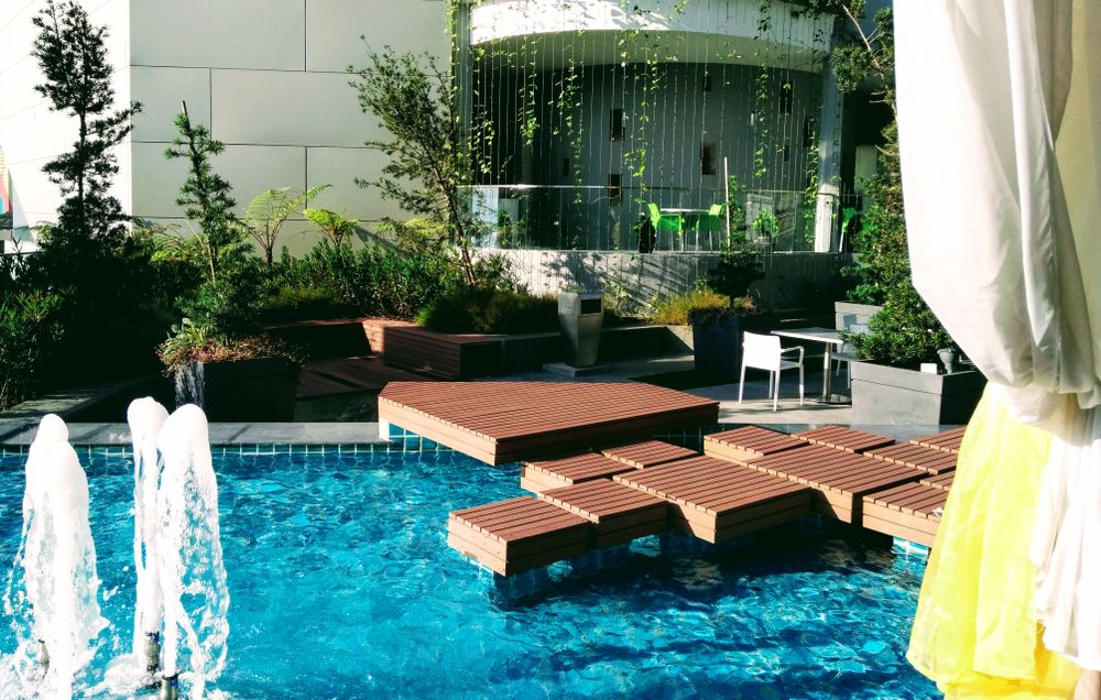 Swimming pool surrounded by paver stone decking