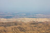 Brown Mountains Near Body of Water