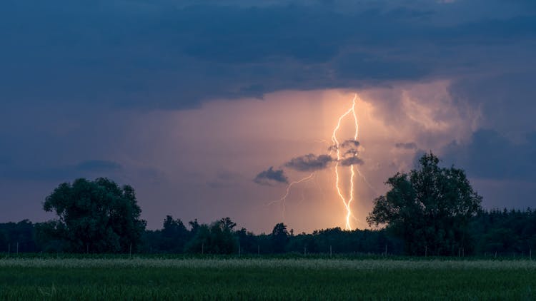 A Lightning Striking On A Field