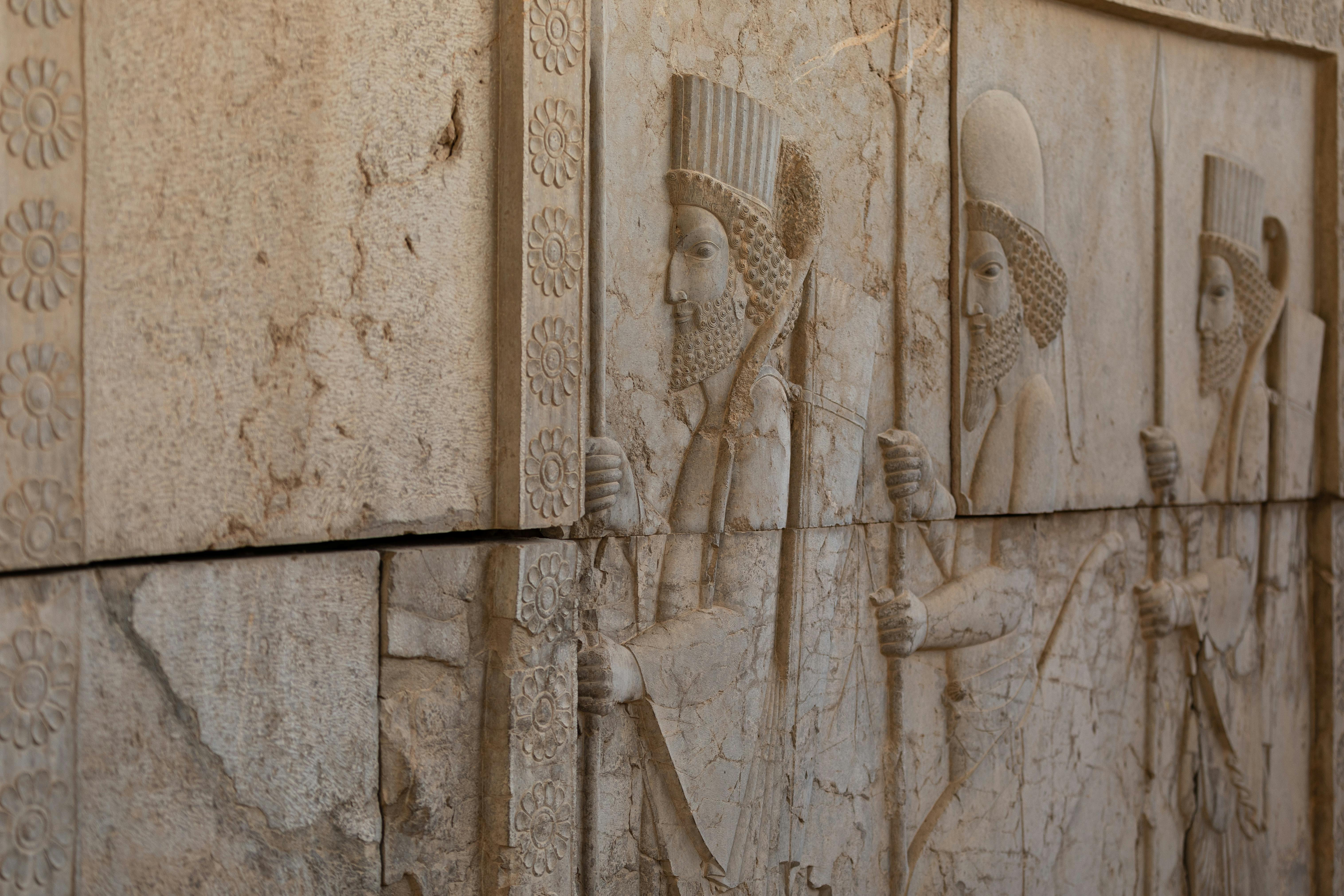 carvings at the wall of the gate of all nations in persepolis iran