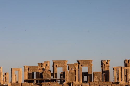 Free Explore the majestic Apadana ruins of Persepolis under a clear blue sky, showcasing Persian architecture. Stock Photo