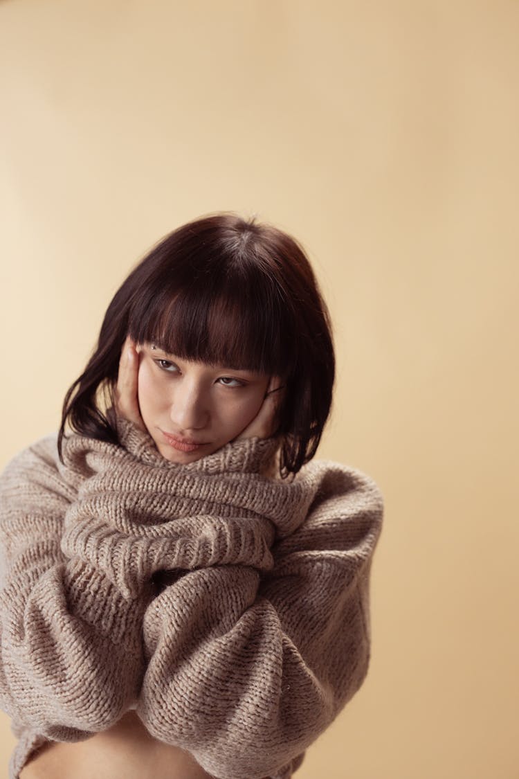 A Woman In Brown Turtleneck Sweater