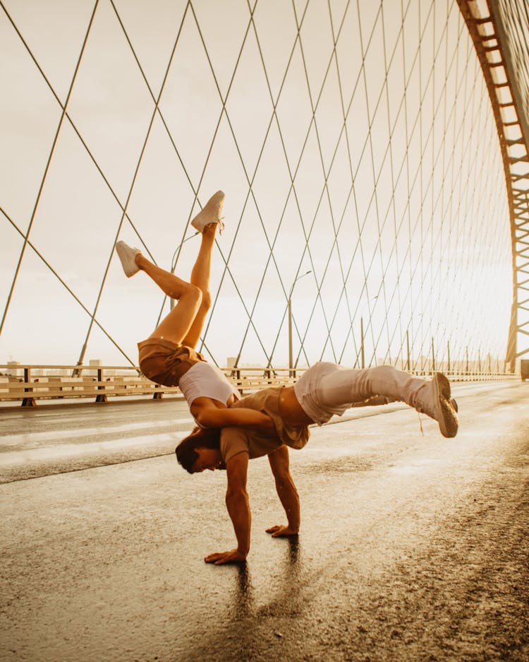 Cool Dancers Performing Break Dance On Suspension Bridge