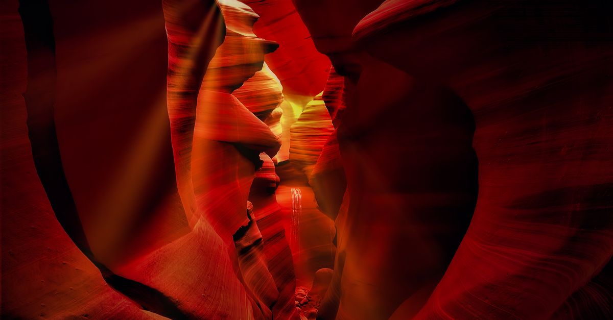 Beautiful red rock formations in Antelope Canyon, Arizona, captured with dramatic lighting.