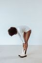 Woman in Bodysuit Bending Her back