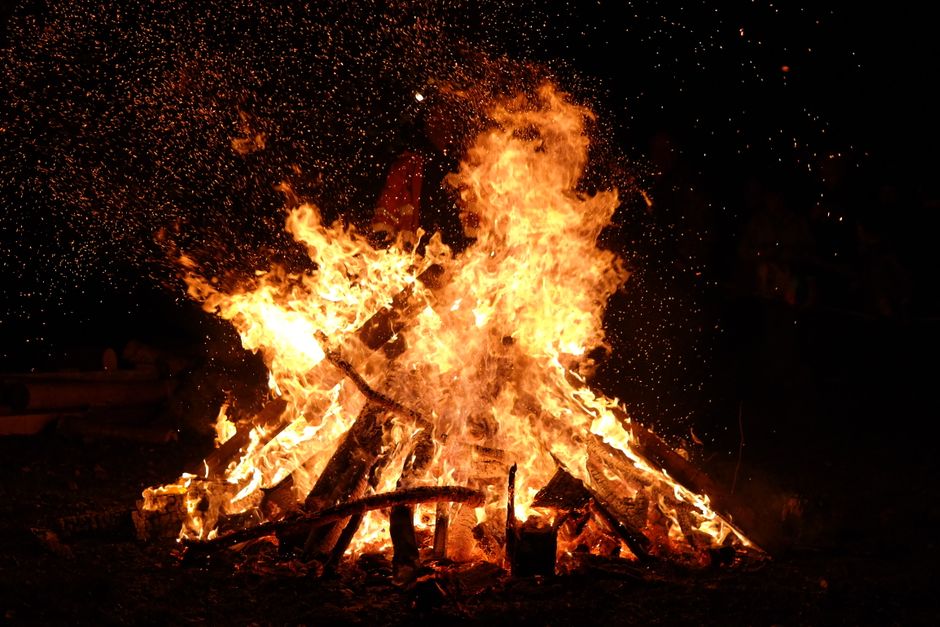 Bonfire burning at night — fire is central to Bwiti ceremony, the tradition from which iboga use originates in Gabon and Central Africa