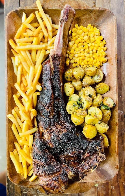 Cooked Food on the Wooden Plate