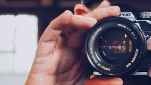 Person Holding Olympus Milc Camera