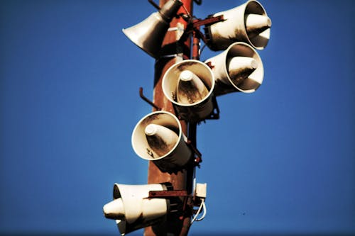 Free Megaphone Speakers on Wooden Post Stock Photo