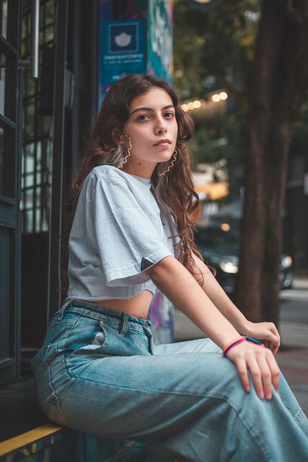 Woman in vintage graphic tee and mom jeans